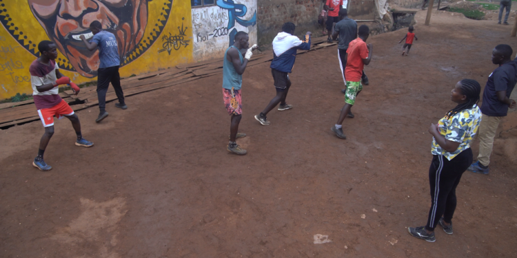 Meet Uganda’s Female Boxing Coach Training Men To Inspire Girls