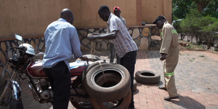 Meet the men scaling up informal jobs in Kampala through tyre recycling